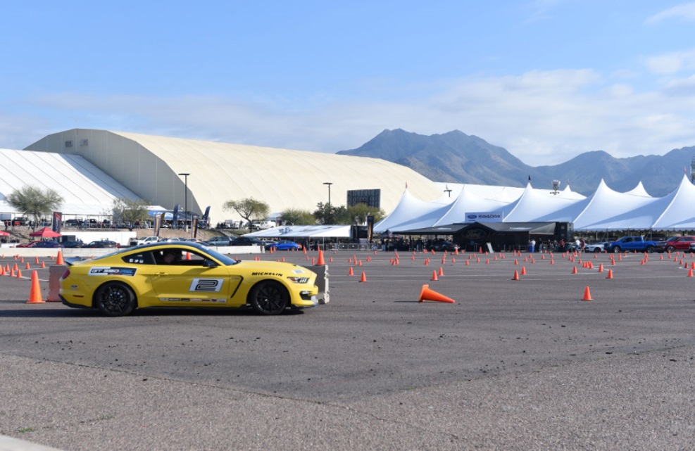 Car being test driven outside Barrett Jackson